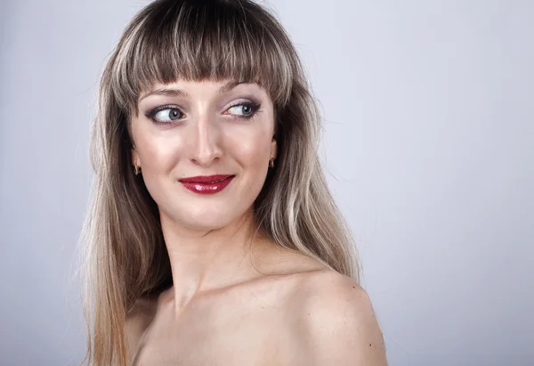 Woman with long hair and make-up in studio — Stock Photo, Image