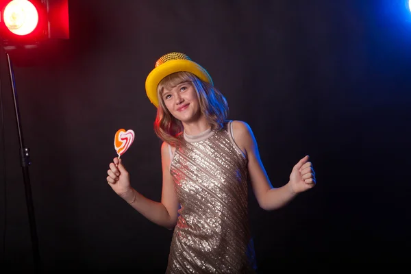 Teenage girl dancing on a black background — Stock Photo, Image