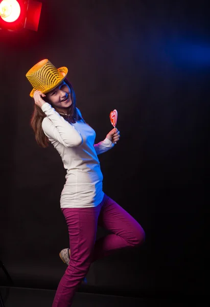 Teenage girl dancing on a black background — Stock Photo, Image