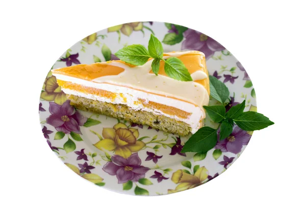 Cake with orange frosting and mint — Stock Photo, Image