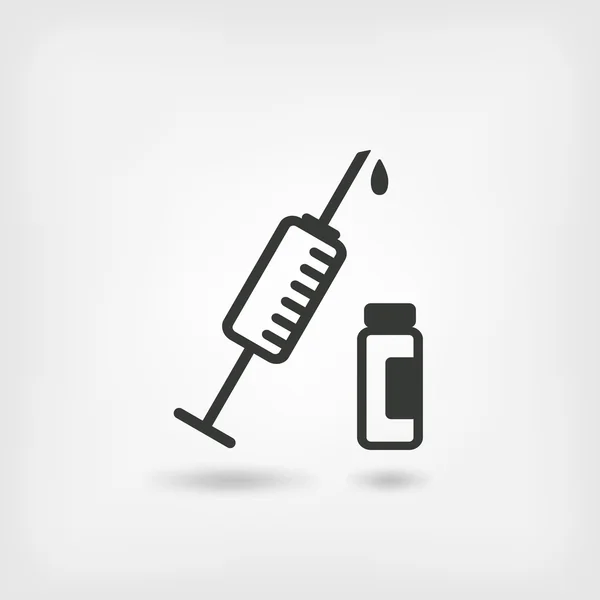 Symbole médical. seringue et flacon — Image vectorielle