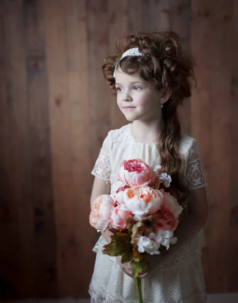 Girl with a bouquet of flowers in retro style — Stock Photo, Image