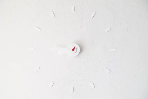 Clock on white wall — Stock Photo, Image