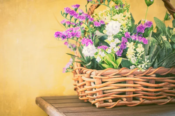 Vintage flowers in basket — Stock Photo, Image