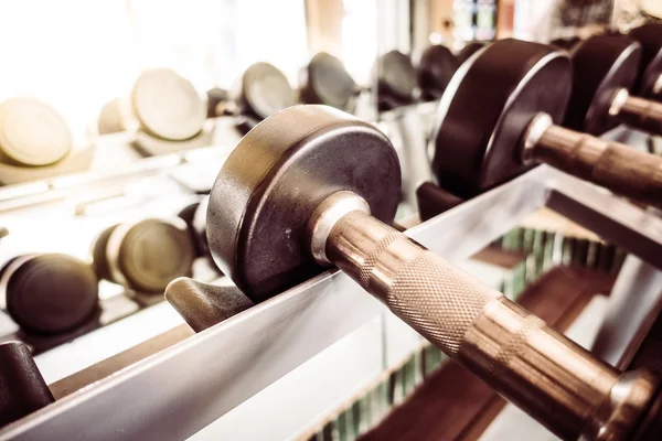 Dumbbell equipment in fitness gym room