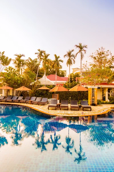 Swimming pool resort at Sunset times — Stock Photo, Image