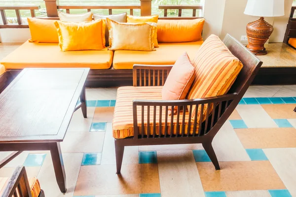 Empty wooden sofa and chair — Stock Photo, Image