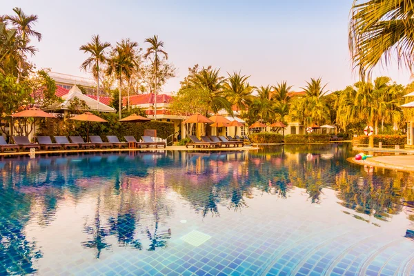 Swimming pool resort at Sunset times — Stock Photo, Image