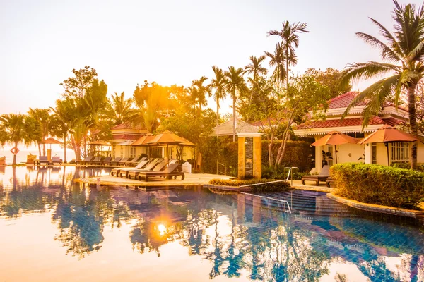 Swimming pool resort at Sunset times — Stock Photo, Image