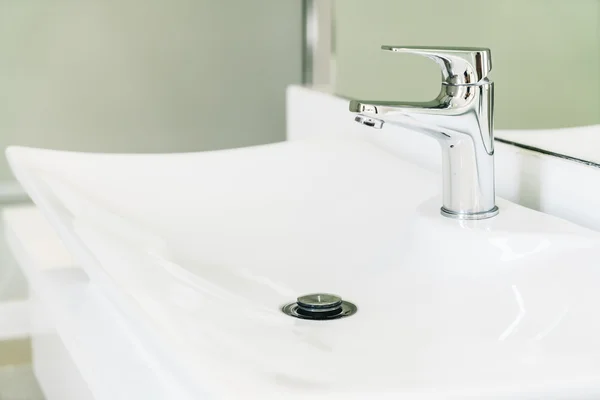 Faucet water in bathroom Stock Picture