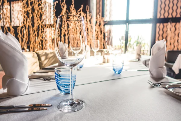 Wine glasses with table setting for dinning — Stock Photo, Image