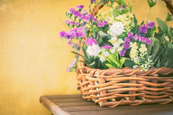 Vintage flowers in basket — Stock Photo, Image