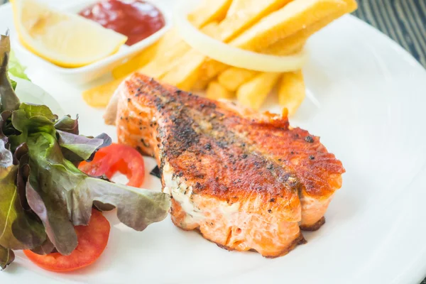 Salmon steak on white plate — Stock Photo, Image