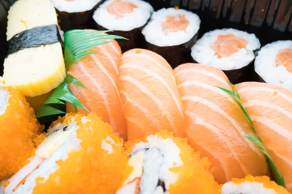 Sushi box with roll fresh salmon — Stock Photo, Image