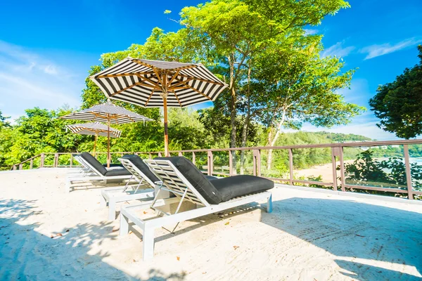 Umbrella and chair — Stock Photo, Image