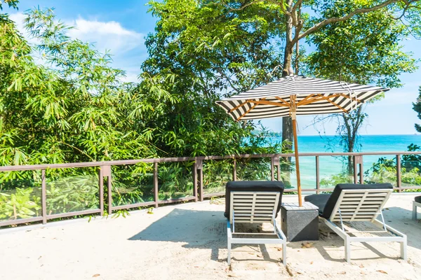 Umbrella and chair — Stock Photo, Image