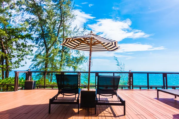 Umbrella and chair — Stock Photo, Image