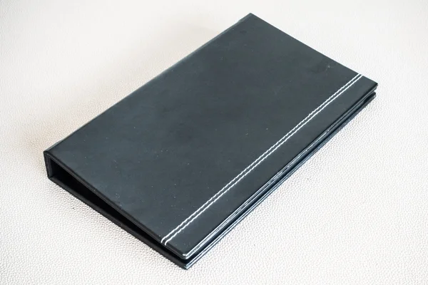 Black book on leather — Stock Photo, Image