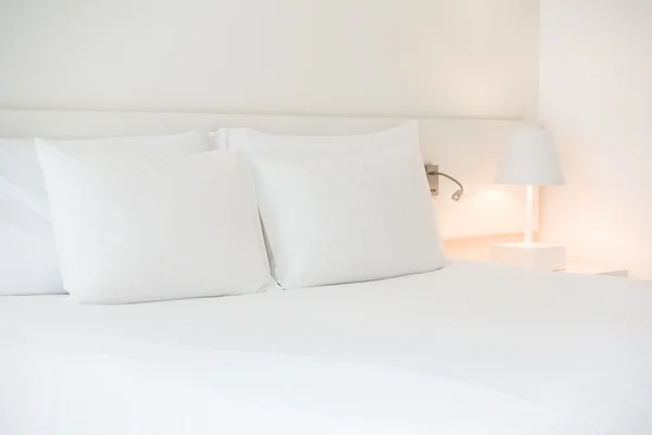 White pillow on bed — Stock Photo, Image