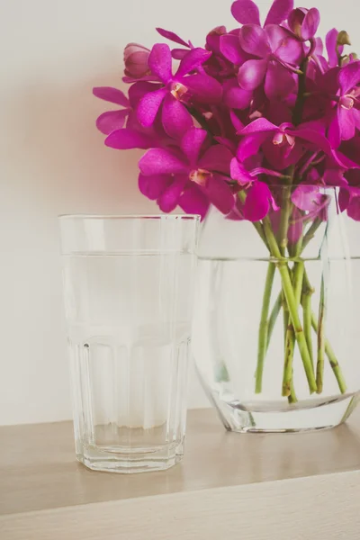 Water glass with orchid flower — Stock Photo, Image