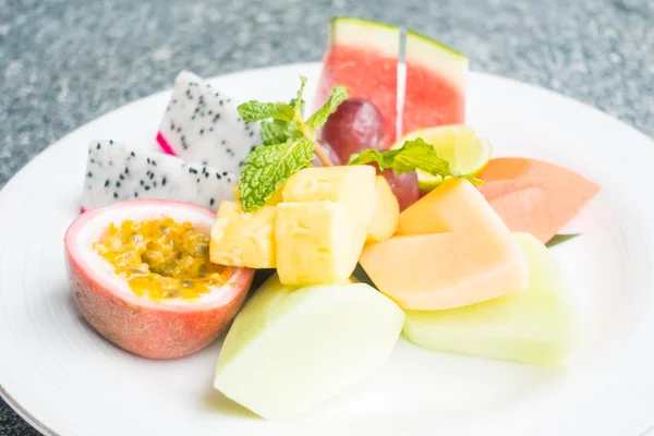 Fruit on white plate — Stock Photo, Image