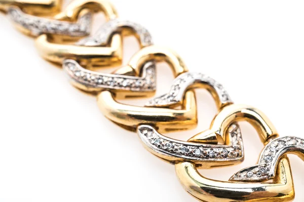 Золотой браслет и бриллиантовые украшения — стоковое фото