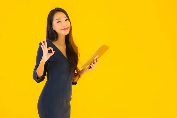 Portrait Beautiful Young Asian Woman Smart Tablet Electronic Yellow Isolated — Stock Photo, Image