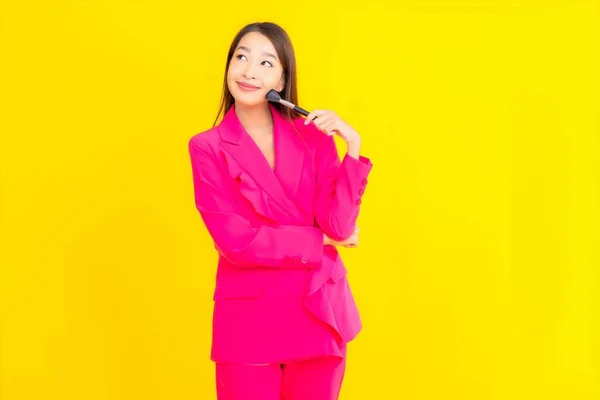 Portrait Beautiful Young Asian Woman Make Brush Yellow Isolated Background — Stock Photo, Image