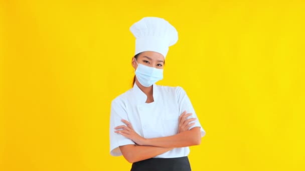 Portrait Beautiful Young Asian Chef Crossed Arms Yellow Background — Stock Video