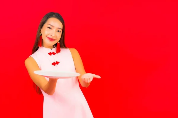 Portrait Beautiful Young Asian Woman Empty Plate Dish Red Isolated — Stock Photo, Image