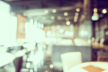 Arka plan için soyut bulanıklık ve odaklanmış kahve dükkanı ve restoran iç mekanı
