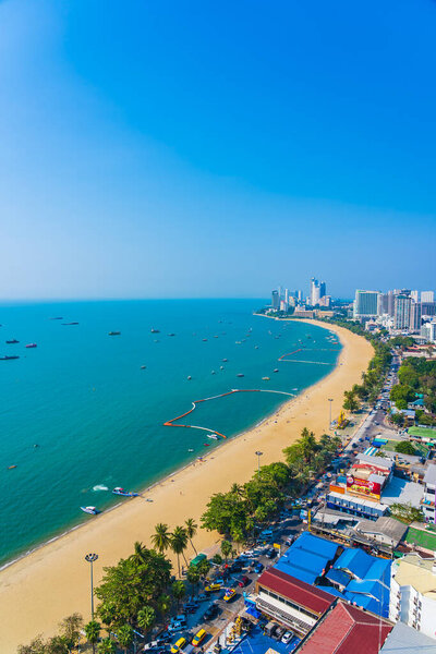 Beautiful tropical beach sea ocean bay around white cloud blue sky and architecture building in Pattaya city Thailand