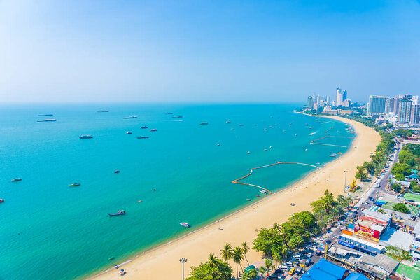 Beautiful tropical beach sea ocean bay around white cloud blue sky and architecture building in Pattaya city Thailand