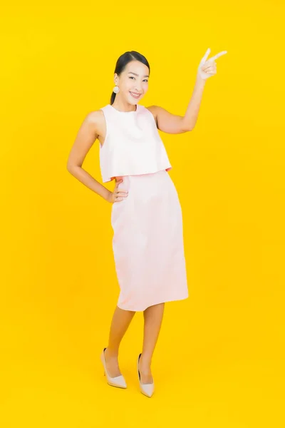 Portrait Beautiful Young Asian Woman Smile Action Yellow Color Background — Stock Photo, Image