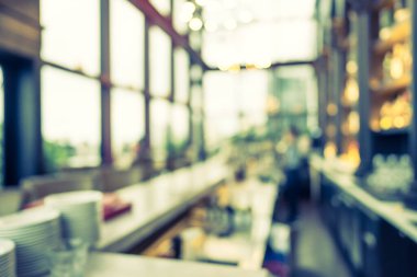 Arka plan için soyut bulanıklık ve odaklanmış kahve dükkanı ve restoran iç mekanı