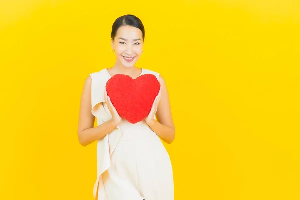 Portrait Beautiful Young Asian Woman Smile Heart Pillow Shape Yellow — Stock Photo, Image