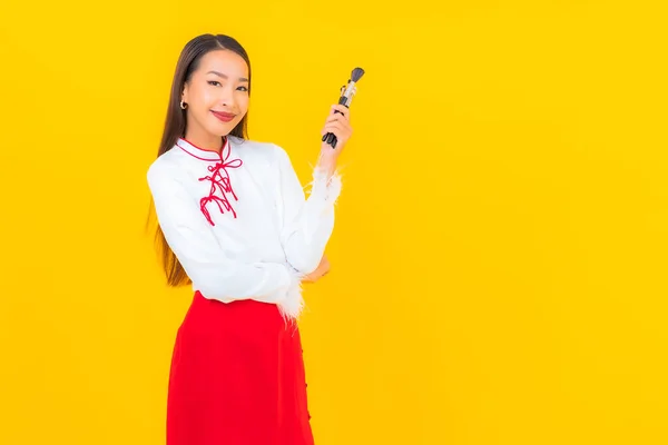 Portrait Beautiful Young Asian Woman Make Brush Cosmetic Yellow Background — Stock Photo, Image