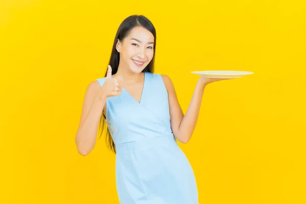 Portrait Beautiful Young Asian Woman Smile Empty Plate Dish Yellow — Stock Photo, Image