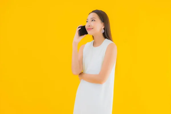 Portrait Beautiful Young Asian Woman Smart Mobile Phone Yellow Isolated — Stock Photo, Image