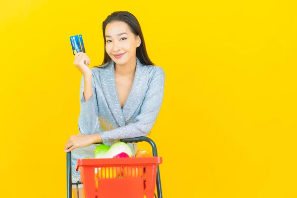 Portrait Beautiful Young Asian Woman Smile Grocery Basket Supermarket Yellow — Stock Photo, Image