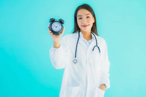 Portrait Beautiful Young Asian Doctor Woman Clock Alarm Blue Isolated — Stock Photo, Image