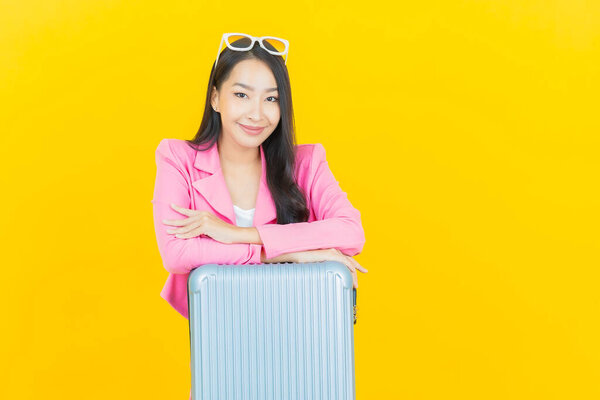 Portrait beautiful young asian woman with luggage bag and passport ready for travel