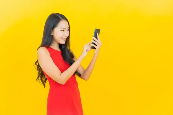 Portrait Beautiful Young Asian Woman Smile Smart Mobile Phone Yellow — Stock Photo, Image