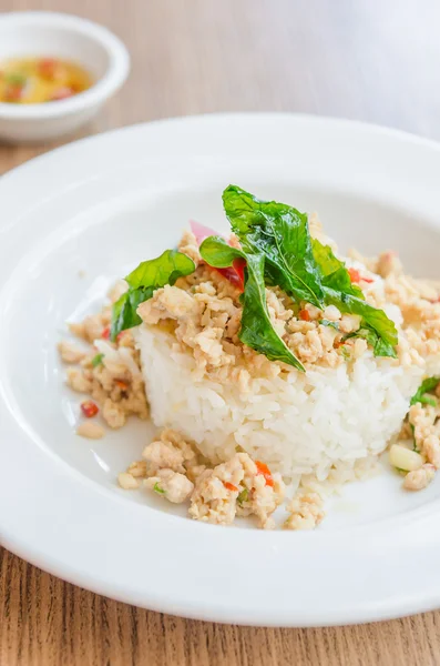 Spicy fried chicken with basil and rice — Stock Photo, Image