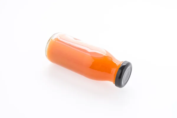 Бутылка апельсинового сока на белом фоне — стоковое фото