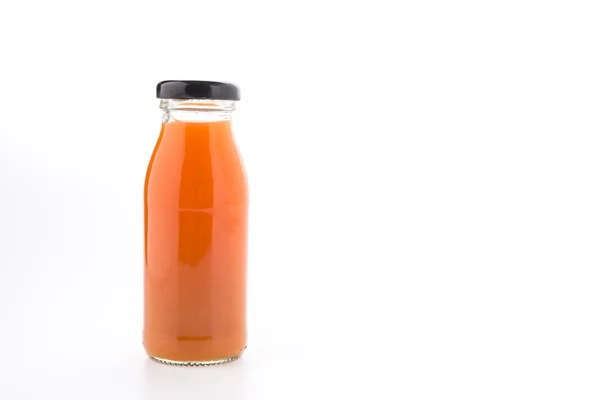 Бутылка апельсинового сока на белом фоне — стоковое фото