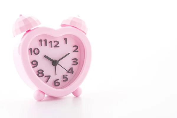 Relógio de alarme rosa isolado no fundo branco — Fotografia de Stock