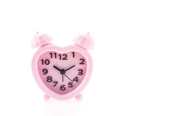 Reloj despertador rosa aislado sobre fondo blanco —  Fotos de Stock