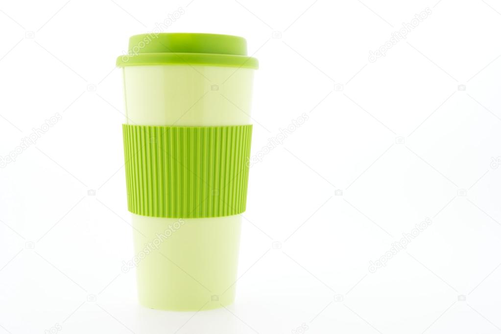 Green plastic coffee mug isolated on white background