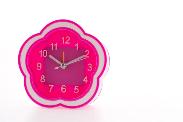 흰색 배경에 분리 된 분홍빛 자명종 시계 — 스톡 사진